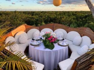 Intimate family dining setup overlooking a jungle